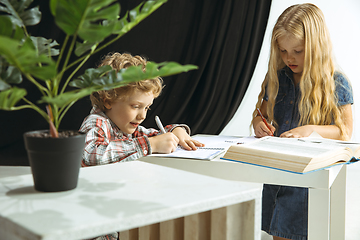 Image showing Boy and girl preparing for school after a long summer break. Back to school.