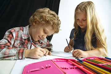 Image showing Boy and girl preparing for school after a long summer break. Back to school.