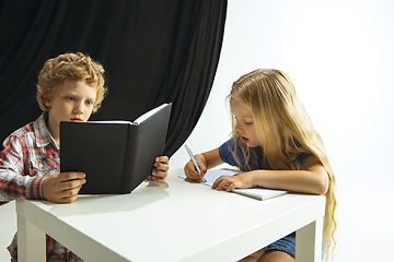 Image showing Boy and girl preparing for school after a long summer break. Back to school.