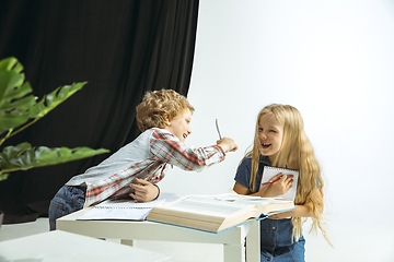 Image showing Boy and girl preparing for school after a long summer break. Back to school.