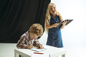 Image showing Boy and girl preparing for school after a long summer break. Back to school.