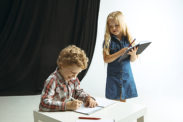 Image showing Boy and girl preparing for school after a long summer break. Back to school.