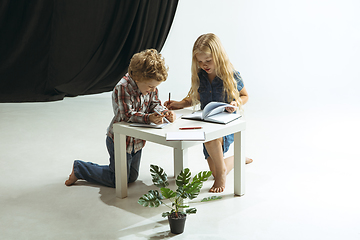 Image showing Boy and girl preparing for school after a long summer break. Back to school.