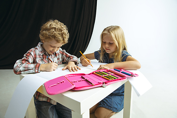 Image showing Boy and girl preparing for school after a long summer break. Back to school.