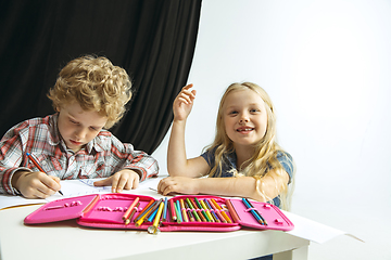 Image showing Boy and girl preparing for school after a long summer break. Back to school.