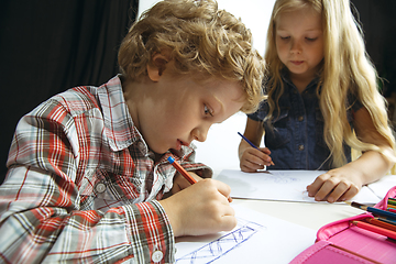 Image showing Boy and girl preparing for school after a long summer break. Back to school.