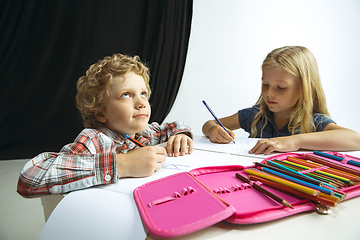 Image showing Boy and girl preparing for school after a long summer break. Back to school.