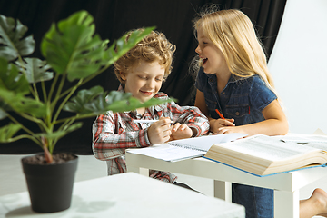 Image showing Boy and girl preparing for school after a long summer break. Back to school.