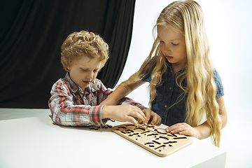 Image showing Boy and girl preparing for school after a long summer break. Back to school.