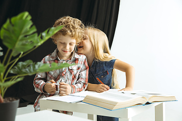 Image showing Boy and girl preparing for school after a long summer break. Back to school.