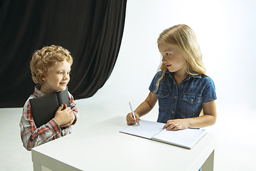 Image showing Boy and girl preparing for school after a long summer break. Back to school.