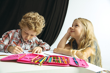 Image showing Boy and girl preparing for school after a long summer break. Back to school.