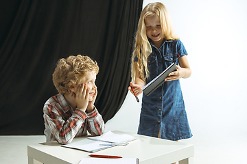 Image showing Boy and girl preparing for school after a long summer break. Back to school.