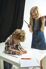 Image showing Boy and girl preparing for school after a long summer break. Back to school.