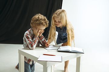 Image showing Boy and girl preparing for school after a long summer break. Back to school.