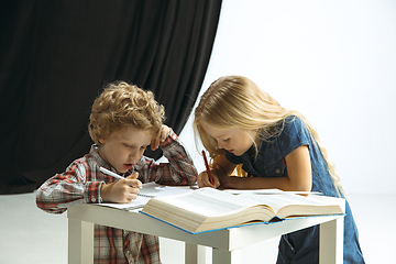 Image showing Boy and girl preparing for school after a long summer break. Back to school.