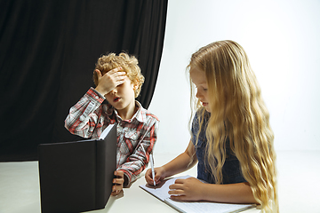 Image showing Boy and girl preparing for school after a long summer break. Back to school.