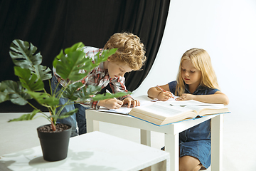 Image showing Boy and girl preparing for school after a long summer break. Back to school.