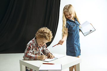 Image showing Boy and girl preparing for school after a long summer break. Back to school.