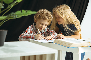 Image showing Boy and girl preparing for school after a long summer break. Back to school.