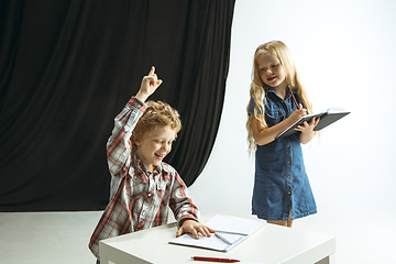 Image showing Boy and girl preparing for school after a long summer break. Back to school.