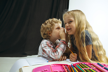 Image showing Boy and girl preparing for school after a long summer break. Back to school.