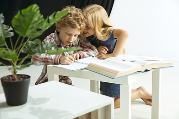 Image showing Boy and girl preparing for school after a long summer break. Back to school.