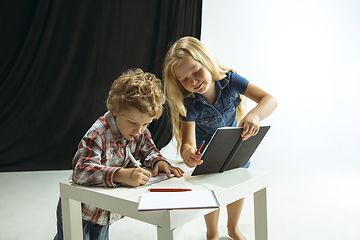 Image showing Boy and girl preparing for school after a long summer break. Back to school.