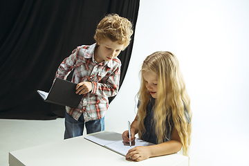 Image showing Boy and girl preparing for school after a long summer break. Back to school.