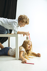 Image showing Boy and girl preparing for school after a long summer break. Back to school.