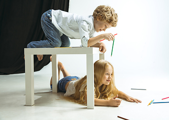 Image showing Boy and girl preparing for school after a long summer break. Back to school.