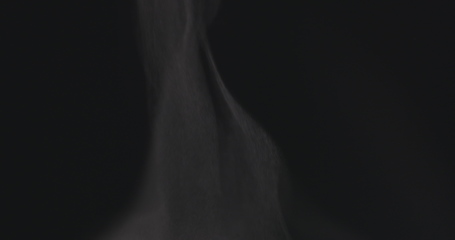 Image showing Steam rising from below against dark background