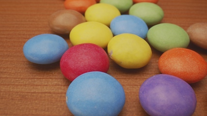 Image showing Colorful chocolate confectionery in camera motion