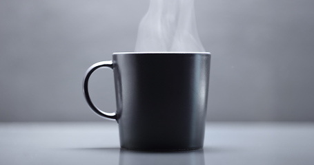 Image showing Vapor rising from hot mug closeup footage