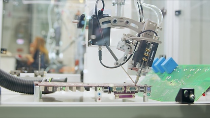 Image showing Automated robotic equipment at work