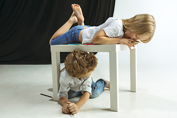 Image showing Boy and girl preparing for school after a long summer break. Back to school.