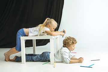 Image showing Boy and girl preparing for school after a long summer break. Back to school.