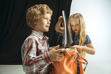 Image showing Boy and girl preparing for school after a long summer break. Back to school.