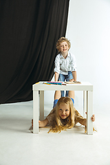 Image showing Boy and girl preparing for school after a long summer break. Back to school.