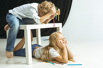 Image showing Boy and girl preparing for school after a long summer break. Back to school.