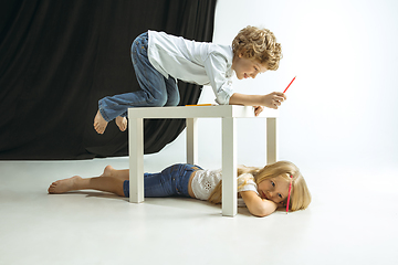 Image showing Boy and girl preparing for school after a long summer break. Back to school.