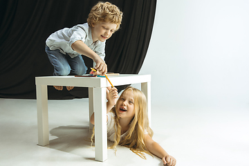 Image showing Boy and girl preparing for school after a long summer break. Back to school.