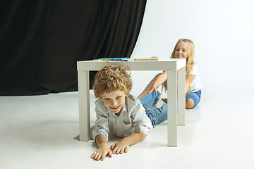 Image showing Boy and girl preparing for school after a long summer break. Back to school.