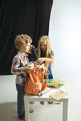 Image showing Boy and girl preparing for school after a long summer break. Back to school.