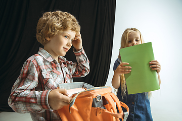 Image showing Boy and girl preparing for school after a long summer break. Back to school.