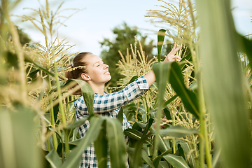 Image showing Young farmer working at his garden in sunny day