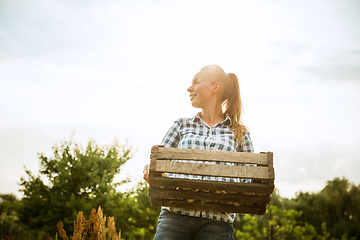 Image showing Young farmer working at his garden in sunny day