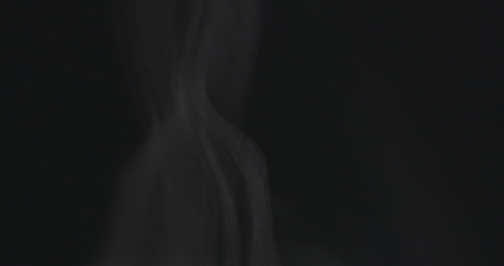 Image showing Steam rising from below against dark background