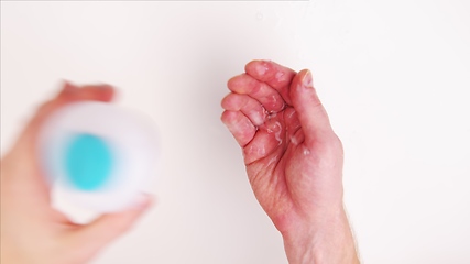 Image showing Washing hands with fluid disinfectant closeup footage