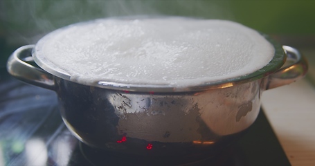 Image showing Steam or vapor clouds rising from boiling water